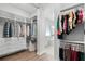 The walk-in closet features custom shelves and hanging storage for ample space at 9250 Neher St, Orlando, FL 32827
