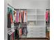 The closet features custom built-in shelves and drawers for maximum storage at 9250 Neher St, Orlando, FL 32827