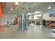 A spacious gym with modern equipment, large windows, and plenty of natural light for a great workout at 9250 Neher St, Orlando, FL 32827