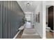 Modern hallway showcasing textured wall accents, recessed lighting, and stylish hardwood flooring at 9250 Neher St, Orlando, FL 32827