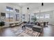 Spacious living room with abundant natural light, stylish decor, and an inviting seating area at 9250 Neher St, Orlando, FL 32827