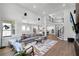 Expansive open-concept living space with high ceilings and a view into multiple rooms at 9250 Neher St, Orlando, FL 32827