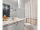 Cozy bathroom featuring neutral finishes, a shower with curtain and decorated mirror at 940 Douglas Ave # 118, Altamonte Springs, FL 32714