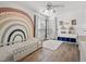 Stylishly decorated bedroom with playful wall art and hardwood floors at 940 Douglas Ave # 118, Altamonte Springs, FL 32714