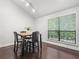 Bright dining area featuring sleek hardwood flooring and large windows for ample natural light at 940 Douglas Ave # 118, Altamonte Springs, FL 32714