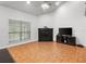 Cozy living room featuring a fireplace, neutral walls, and large windows for ample natural light at 940 Douglas Ave # 118, Altamonte Springs, FL 32714