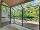 Enclosed patio with a view of the wooded yard and landscaping at 940 Douglas Ave # 118, Altamonte Springs, FL 32714