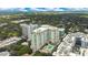 Amazing aerial perspective of condos surrounded by lush trees and city views at 100 S Eola Dr # 1102, Orlando, FL 32801