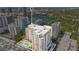 Stunning aerial view of condominium with rooftop pool, lake views, and downtown cityscapes at 100 S Eola Dr # 1102, Orlando, FL 32801