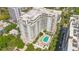 An impressive aerial view of a high rise condo with a relaxing pool area at 100 S Eola Dr # 1102, Orlando, FL 32801