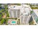 Breathtaking aerial capture of high-rise condos with stunning pool and urban view at 100 S Eola Dr # 1102, Orlando, FL 32801