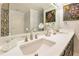 This elegant bathroom offers dual sinks, stylish fixtures, and tasteful decor for a luxurious feel at 100 S Eola Dr # 1102, Orlando, FL 32801
