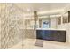 Spa-like bathroom with a glass-enclosed shower, double vanity, and modern finishes at 100 S Eola Dr # 1102, Orlando, FL 32801