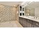 Contemporary bathroom featuring a walk-in shower, dual sinks, and chic design elements at 100 S Eola Dr # 1102, Orlando, FL 32801