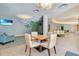 Comfortable common area with seating, dining table, and modern beach-themed decor at 100 S Eola Dr # 1102, Orlando, FL 32801