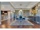 Elegant dining room features hardwood floors, modern lighting, and unique accent wall with designer touches at 100 S Eola Dr # 1102, Orlando, FL 32801