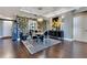 Formal dining room with hardwood floors, contemporary decor, statement wall, and a view of the kitchen at 100 S Eola Dr # 1102, Orlando, FL 32801