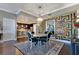 Dining room with hardwood floors, contemporary decor, and adjacent to the kitchen at 100 S Eola Dr # 1102, Orlando, FL 32801