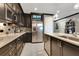 Stylish kitchen features stainless steel appliances, white countertops, and modern cabinetry for ample storage at 100 S Eola Dr # 1102, Orlando, FL 32801