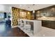 Modern kitchen boasts quartz countertops, stainless steel appliances, and stylish bar seating for casual dining at 100 S Eola Dr # 1102, Orlando, FL 32801