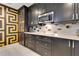 Gourmet kitchen with stainless steel appliances, sleek cabinetry, and custom backsplash for a luxurious cooking experience at 100 S Eola Dr # 1102, Orlando, FL 32801