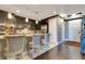 Stylish kitchen features dark cabinetry, stainless steel appliances, and a breakfast bar with seating at 100 S Eola Dr # 1102, Orlando, FL 32801