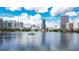 Scenic view of downtown Orlando skyline with a lake and fountain at 100 S Eola Dr # 1102, Orlando, FL 32801