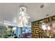 Open concept living area featuring modern hanging lights, living area and dining space at 100 S Eola Dr # 1102, Orlando, FL 32801