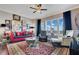 Cozy living room with plush seating, area rug, and large windows providing plenty of natural light at 100 S Eola Dr # 1102, Orlando, FL 32801