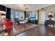 Well decorated living room featuring a flat screen tv, art, large windows, and access to balcony at 100 S Eola Dr # 1102, Orlando, FL 32801