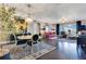 Open floor plan blends the dining room with a spacious living area, complete with expansive windows and stylish decor at 100 S Eola Dr # 1102, Orlando, FL 32801