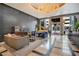 Elegant lobby with chandelier, piano, modern furniture, and luxurious accents at 100 S Eola Dr # 1102, Orlando, FL 32801