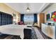 Luxurious main bedroom with stylish decor, a large window, and elegant furnishings at 100 S Eola Dr # 1102, Orlando, FL 32801