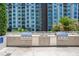 This outdoor kitchen includes stainless steel appliances and wooden cabinetry at 100 S Eola Dr # 1102, Orlando, FL 32801