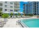 Resort-style pool area with lounge chairs, cabanas, and lush landscaping at 100 S Eola Dr # 1102, Orlando, FL 32801