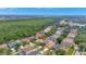 An aerial view of a home in a well-maintained neighborhood with mature trees providing a peaceful setting at 11209 Taeda Dr, Orlando, FL 32832