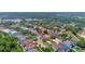 Aerial view of a single Gathering home in a neatly planned community with mature trees and two nearby lakes at 11209 Taeda Dr, Orlando, FL 32832