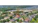 This is an aerial view of a single-Gathering home with pool in a neighborhood that features manicured lawns at 11209 Taeda Dr, Orlando, FL 32832