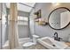 Stylish bathroom features a tub-shower, sleek vanity, and modern fixtures for a spa-like feel at 11209 Taeda Dr, Orlando, FL 32832