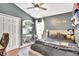Cozy bedroom with a sloped ceiling, plush rug, and charming decor and closet at 11209 Taeda Dr, Orlando, FL 32832