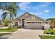 Attractive single-story home with a two-car garage, landscaped front yard, and neutral exterior paint at 11209 Taeda Dr, Orlando, FL 32832