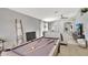 Open living space featuring a pool table, neutral color scheme, and seamless flow to the Gathering room at 11209 Taeda Dr, Orlando, FL 32832