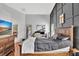 Spacious main bedroom featuring a dark accent wall, wood floors and a large dresser at 11209 Taeda Dr, Orlando, FL 32832