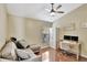 Bright home office offers a comfortable seating area, desk space, and natural light at 11209 Taeda Dr, Orlando, FL 32832