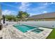 The backyard boasts a sparkling pool with attached spa and ample room for lounging at 11209 Taeda Dr, Orlando, FL 32832