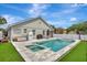 Enjoy your private pool and backyard oasis complete with a putting green and luxurious amenities at 11209 Taeda Dr, Orlando, FL 32832