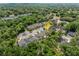 High angle shot of a home in a neighborhood surrounded by mature trees and green space at 116 Hurst Ct, Deland, FL 32724
