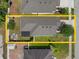 Aerial view of a well-maintained property featuring a backyard fire pit and meticulously landscaped yard at 116 Hurst Ct, Deland, FL 32724