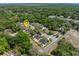 An aerial view displaying the property's setting within a verdant, tree-lined neighborhood at 116 Hurst Ct, Deland, FL 32724