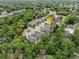 An aerial view of a neighborhood nestled among mature trees showcasing community and location at 116 Hurst Ct, Deland, FL 32724